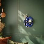 GEOMETRIC EYES Ovales Kunstregal in Schwarz