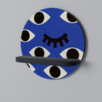 GEOMETRIC EYES Rundes Kunstregal in Schwarz