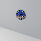 GEOMETRIC EYES Rundes Kunstregal in Eiche-Optik