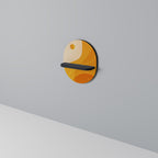 ORANGE ARRANGEMENT Ovales Kunstregal in Schwarz