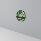 VERDANT PLEASURES Oval Art Shelf In Black Finish