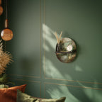 SUNLIT STILLNESS Ovales Kunstregal in Schwarz