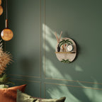 DANCING PREDATORS Ovales Kunstregal in Eiche-Optik